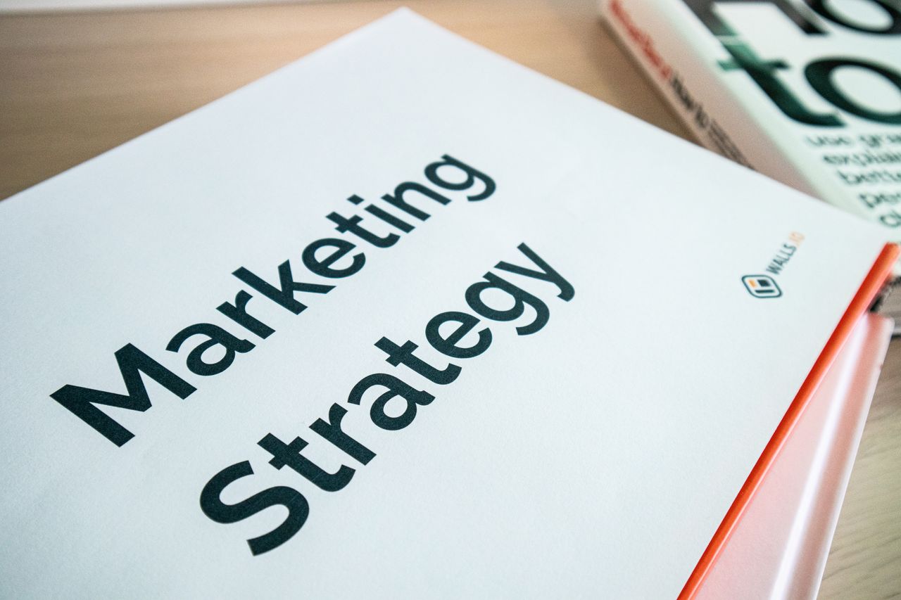 creative-03 Close-up of a marketing strategy document on a desk, ideal for business content.